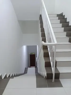 a staircase in a building with a stair case at Hotel Alpha in Bukit Mertajam