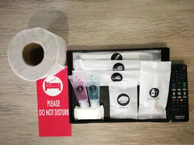 a box with a roll of toilet paper and a remote control at Hotel Alpha in Bukit Mertajam