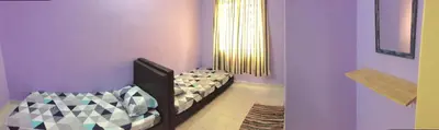 a purple room with a bed and a mirror at Kak's House Musl!m Only in Ipoh