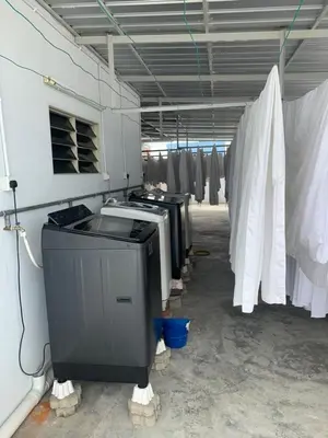 a room with a row of machines in a building at Brezza Hotel Sitiawan in Sitiawan