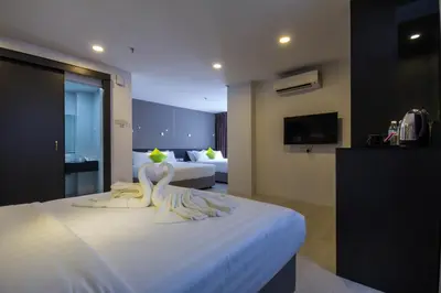 a hotel room with two swans on a bed at Manhattan Hotel Ipoh in Ipoh