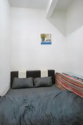 a bedroom with a bed with a cactus on the wall at Tropical Dream CH night market in Cameron Highlands