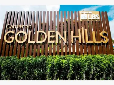 a sign that says canadian colbertittle behind a hedge at Play Residence at Golden Hills in Cameron Highlands