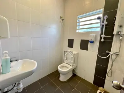 a bathroom with a toilet and a sink at Play Residence at Golden Hills in Cameron Highlands