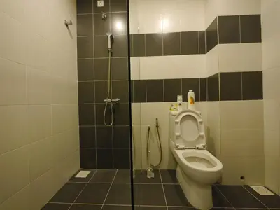a bathroom with a toilet and a shower at Play Residence at Golden Hills in Cameron Highlands