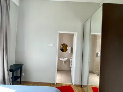 a bedroom with a bathroom with a sink and a toilet at Play Residence at Golden Hills in Cameron Highlands