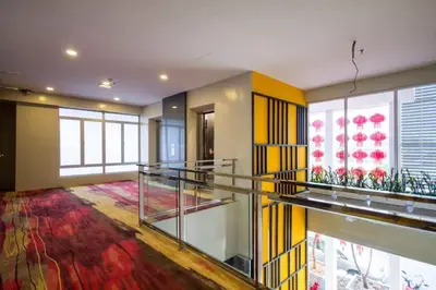 a large room with glass shelves and a large window at OMG Hotel in Simpang Ampat