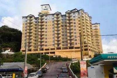 a large building with cars parked in front of it at SA Apartments @ Crown Imperial Court in Cameron Highlands
