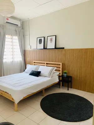 a bedroom with a bed and a window and a rug at D'Houzz in Sungai Petani