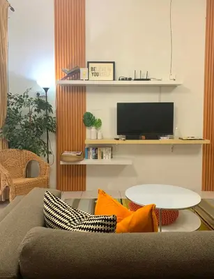 a living room with a couch and a table at D'Houzz in Sungai Petani