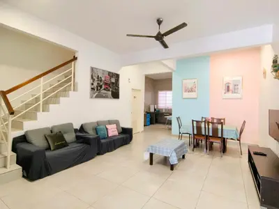 a living room with a couch and a table at MY SWEETHUB HOMESTAY @ CAMERON HIGHLANDS in Cameron Highlands