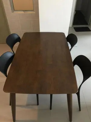 a wooden table with four black chairs around it at Cameron Barrington Square 1Room @ Golden Hill in Cameron Highlands