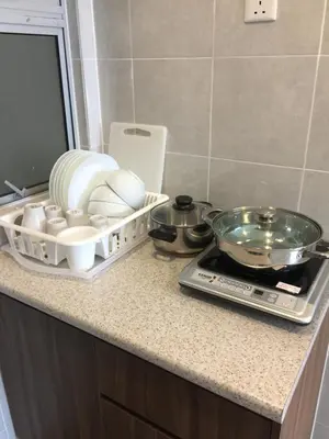 a kitchen counter with a tray of dishes on it at Cameron Barrington Square 1Room @ Golden Hill in Cameron Highlands