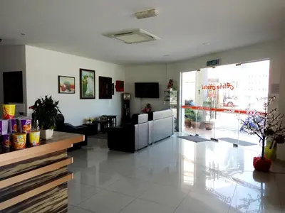 a lobby of a store with a couch and a table at Aloha Hotel in Lumut