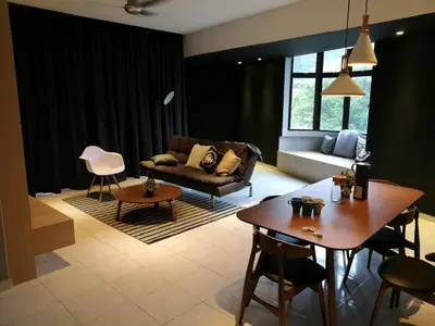 a living room with a couch and a table at Lumut Waterfront Apartment 62 in Lumut