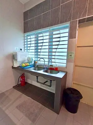 a small kitchen with a sink and a window at Ipoh Meru Animation Homestay by Grab A Stay in Ipoh