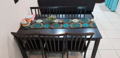 a black table with two chairs and a table with a table cloth at Fahaz Kamunting Taiping in Taiping