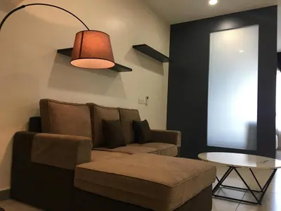 a living room with a couch and a table at PM Octagon Ipoh Suites & Apartment 1 in Ipoh