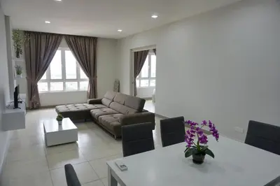 a living room with a couch and a table at PM Octagon Ipoh Suites & Apartment 1 in Ipoh