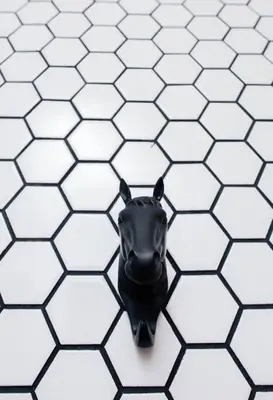 a black mask on a white tiled floor at M Boutique Kampar in Kampar