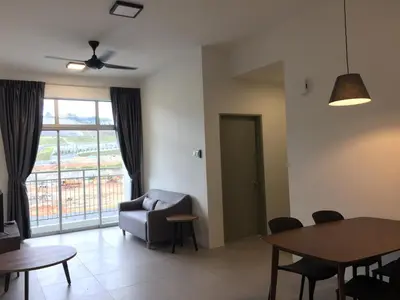 a living room with a chair and a table at Cameron 2Room Square @Golden Hill in Cameron Highlands