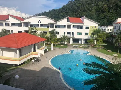 a view of a swimming pool in a resort at Walking Distance To The Beach, Pangkor in Pangkor