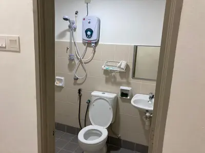 a bathroom with a white toilet and a sink at Walking Distance To The Beach, Pangkor in Pangkor