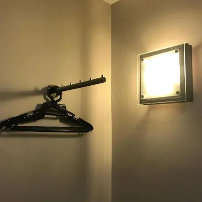 a black towel rack on a wall with a window at Se One Hotel in Butterworth