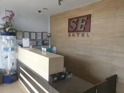 a store front with a sign on a wall at Se One Hotel in Butterworth