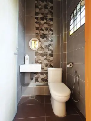 a bathroom with a toilet and a sink at Lodge 163 Ventures in Ipoh