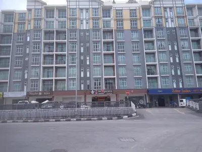 a large building with a parking lot in front of it at Astana Barrington Square Goldenhills Pasar Malam Cameron Highlands in Cameron Highlands