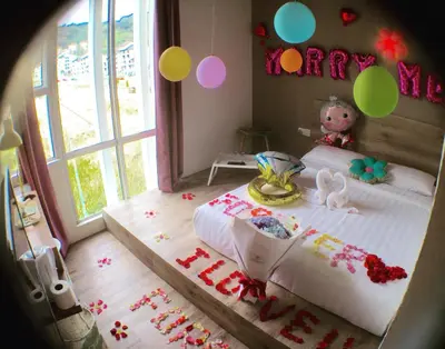 a childs bedroom with a bed with a happy birthday banner at Hotel Flora Plus in Cameron Highlands