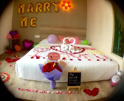 a bedroom with a bed with two rabbits on it at Hotel Flora Plus in Cameron Highlands