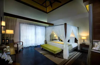 a bedroom with a bed with a canopy at The Banjaran Hotsprings Retreat in Ipoh