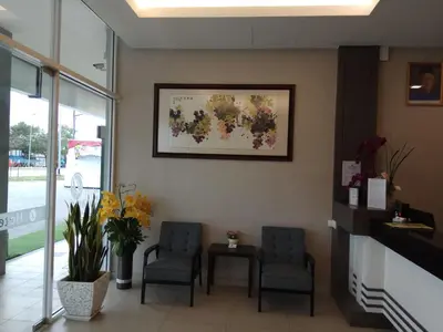 a waiting room with two chairs and a table at Hotel Dutaria in Ipoh