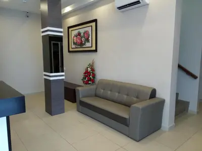 a waiting room with a couch in a lobby at Hotel Dutaria in Ipoh