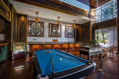 a pool table in a room with a bar at Century Pines Resort Cameron Highlands in Cameron Highlands