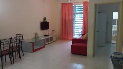 a living room with a red couch and a red chair at Jeffrey Homestay B @ Lost World of Tambun in Ipoh