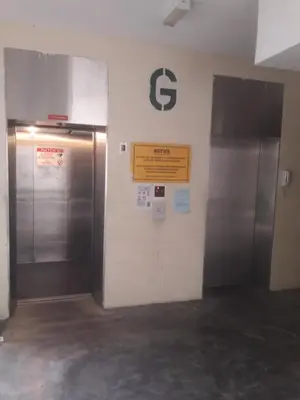 a subway station with two elevators and a sign on a wall at Jeffrey Homestay B @ Lost World of Tambun in Ipoh