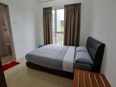 a bedroom with a bed and a large window at My Home Apartment @ Golden Hills in Cameron Highlands
