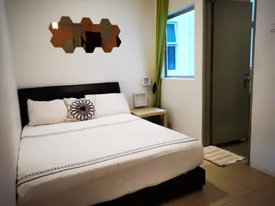 a bedroom with a large bed in a room at My Home Apartment @ Golden Hills in Cameron Highlands