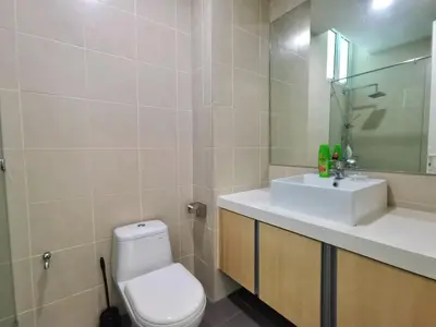 a bathroom with a white toilet and a sink at Southbay Plaza Condominium in Bayan Lepas