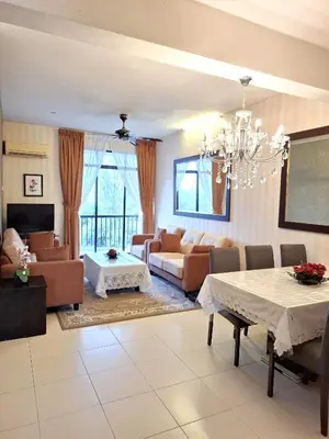 a living room with a couch and a table at Partial Seaview with Wifi, Batu Ferringhi in Batu Ferringhi