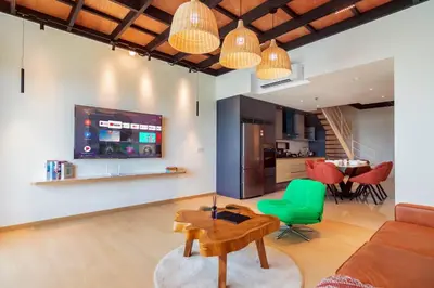 a living room with a couch and a table at Sunrise Gurney in George Town