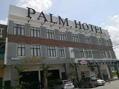 a building with a sign that reads palm hotel at Palm Hotel Ipoh in Ipoh