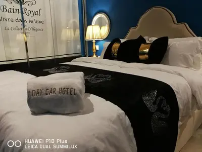 a display of two beds in a hotel room at 1 Day Car Hotel Station 18 in Ipoh
