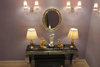 a table with two lamps and a mirror at 1 Day Car Hotel Station 18 in Ipoh