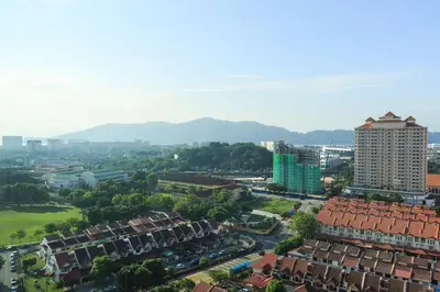 an aerial view of a city with buildings and trees at 3-Bed Executive Suite, RumahKu @CEO in Bayan Lepas