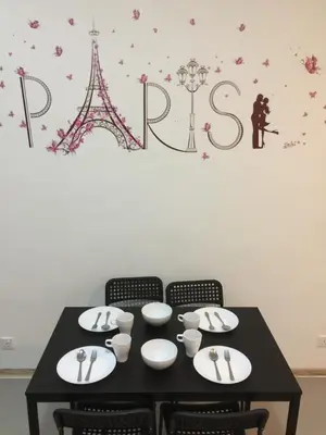 a black table with chairs and the words paris at Cameron DreamWorld Apartment @ Golden Hill in Cameron Highlands