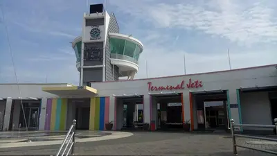 a building with a clock tower on top of it at Lumut Valley Resort Condominium in Lumut